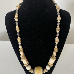 Antique Ivory necklace by Naga By Nevara — antique ivory bead cupped in sterling silver with white coral, origami silver and ostrich egg discs, 60cm.
