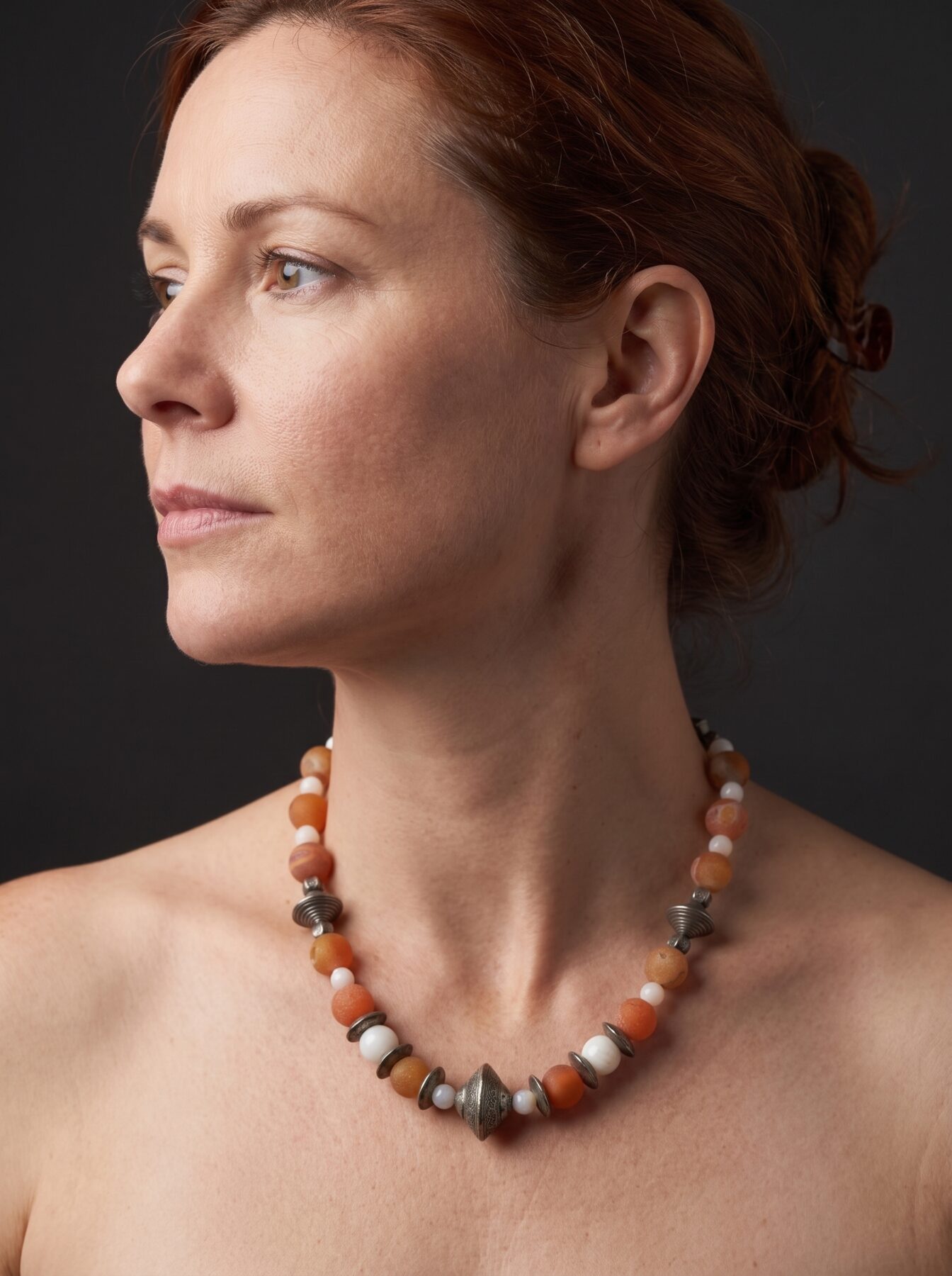 Antique Silver Beads necklace by Naga By Nevara worn by a model, profile view