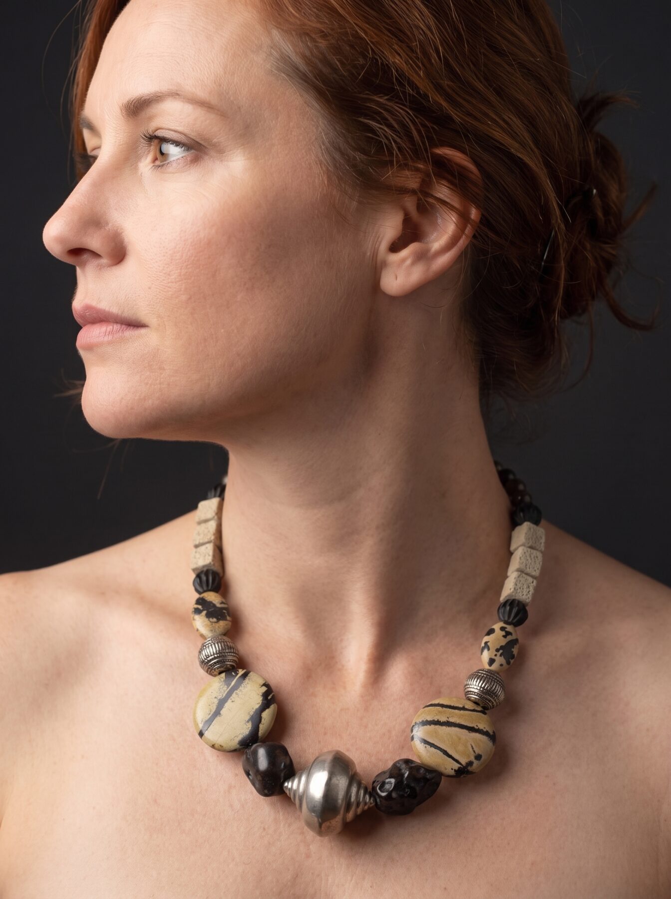 Black Agate necklace by Naga By Nevara worn by a model, profile view