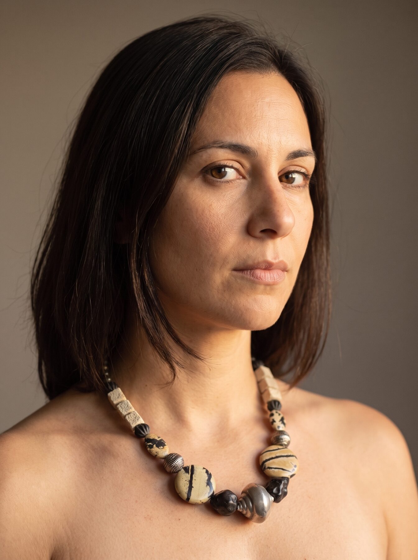 Black Agate necklace by Naga By Nevara worn by a model, three quarter view