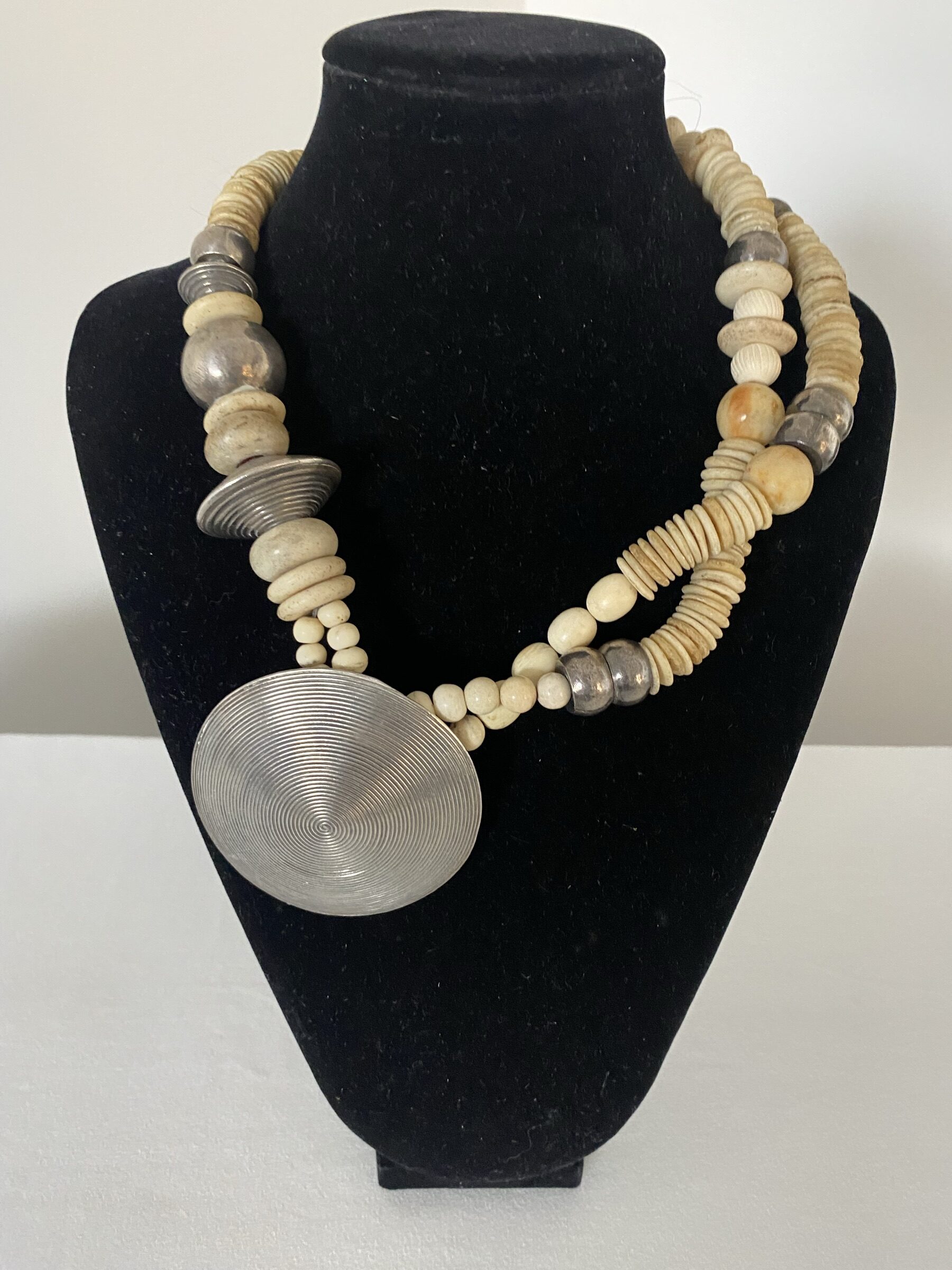 Big Silver Dome Pendant by Naga By Nevara — ostrich egg discs separated by silver beads and white jade beads, 47cm.