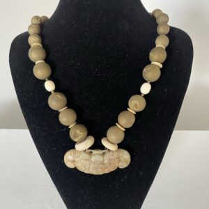 Jade Bat Pendant by Naga By Nevara — jade bat pendant on bone discs with amethyst quartz and ostrich shell discs, 55cm.