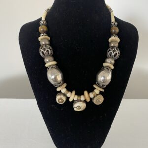 Nepalese Currency necklace by Naga By Nevara — sterling silver and tiger eye with antique three-currency beads from Nepal, 48cm.