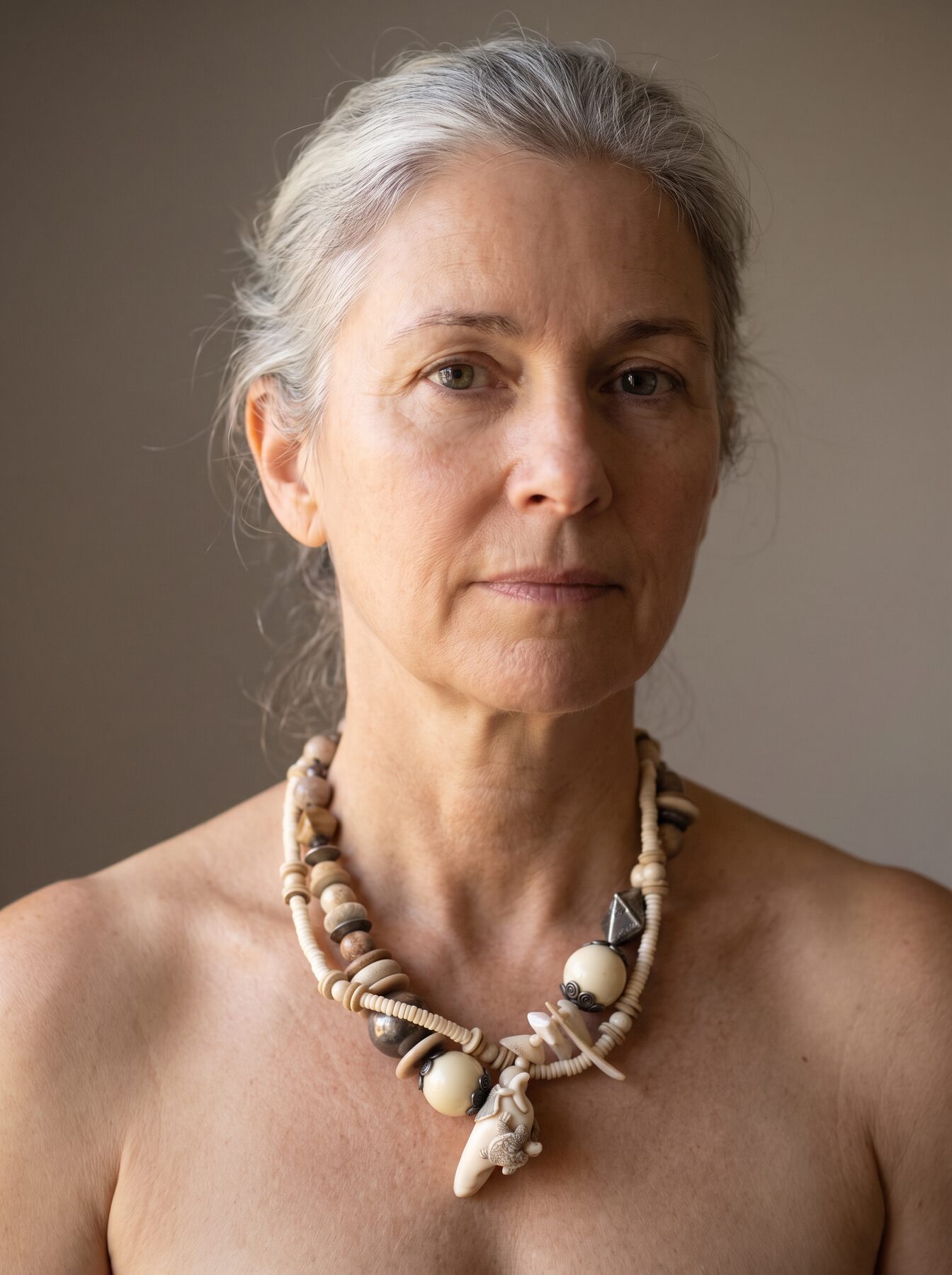Netsuke with Turtle necklace by Naga By Nevara worn by a model, front view