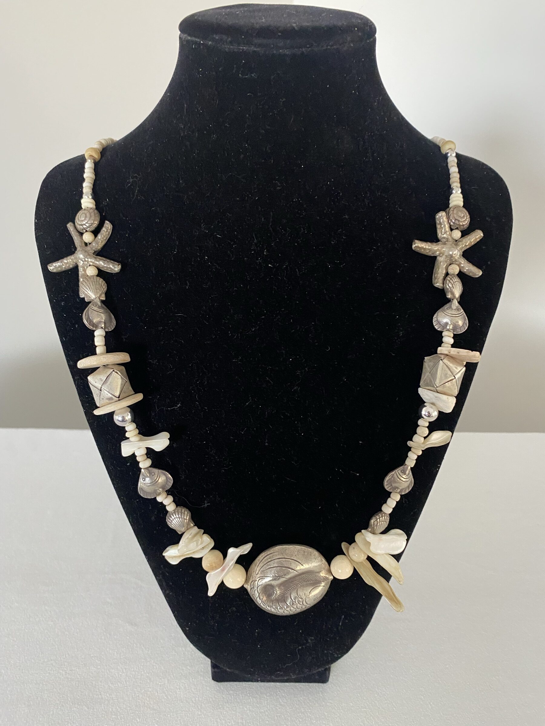 Ocean Gifts necklace by Naga By Nevara — fish, starfish, shells and origami silver with mother of pearl and niihau shells, 70cm.
