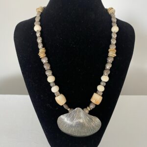 Silver Shell Pendant by Naga By Nevara — large silver shell pendant with white coral, ostrich egg discs and small sterling silver shells, 54cm.